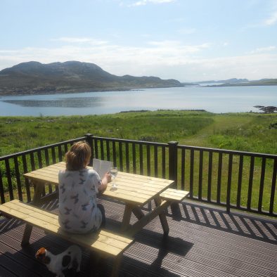 Relax on the decking of our Rowan Chalet whilst enjoying the view over the Summer Isles