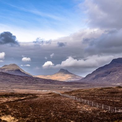 Dark and mysterious skies over Stac Pollaidh as seen from above Ullapool