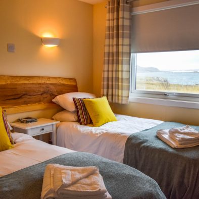 Our twin or superking bedroom with sea view at Port Beag Chalets, Altandhu