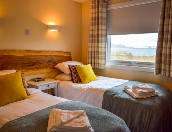 Our twin or superking bedroom with sea view at Port Beag Chalets, Altandhu